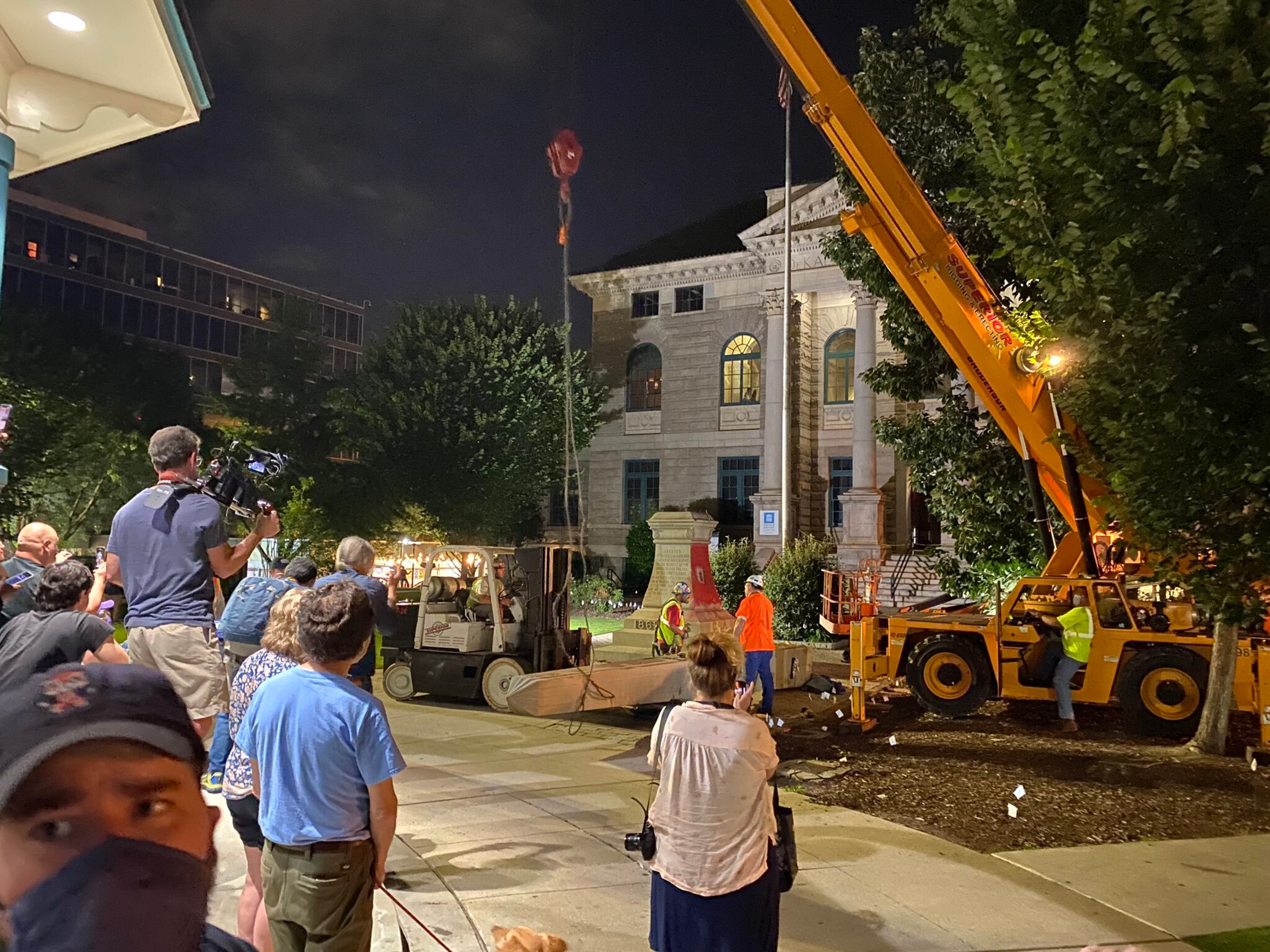 A 30-foot obelisk Confederate moment, which has stood for 112 years, was taken down in the downtown Decatur square late Thursday night. The monument was erected in 1908 by the United Daughters of the Confederacy. Photos by Amanda Coyne / AJC