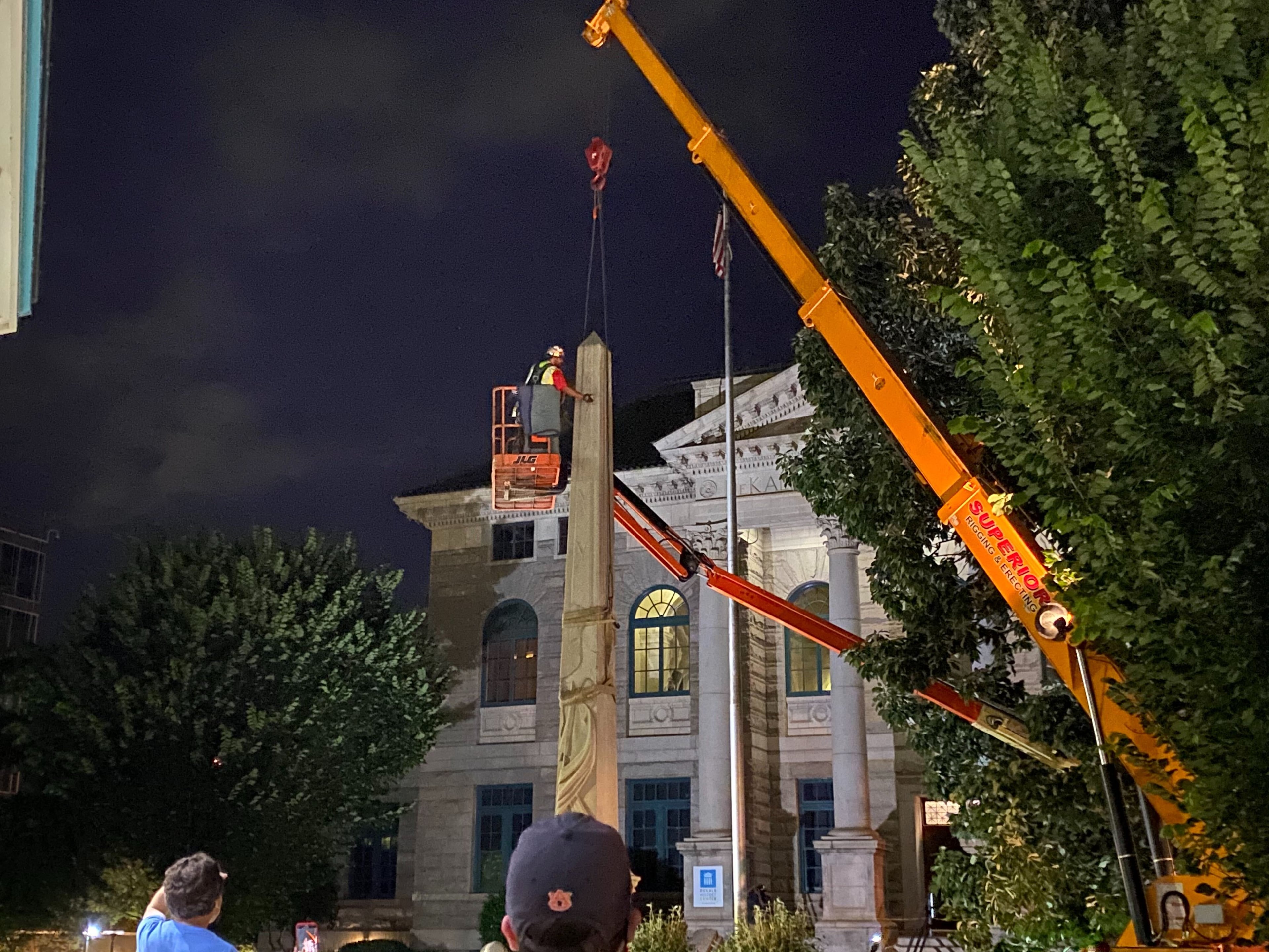 A 30-foot obelisk Confederate moment, which has stood for 112 years, was taken down in the downtown Decatur square late Thursday night. The monument was erected in 1908 by the United Daughters of the Confederacy. Photos by Amanda Coyne / AJC