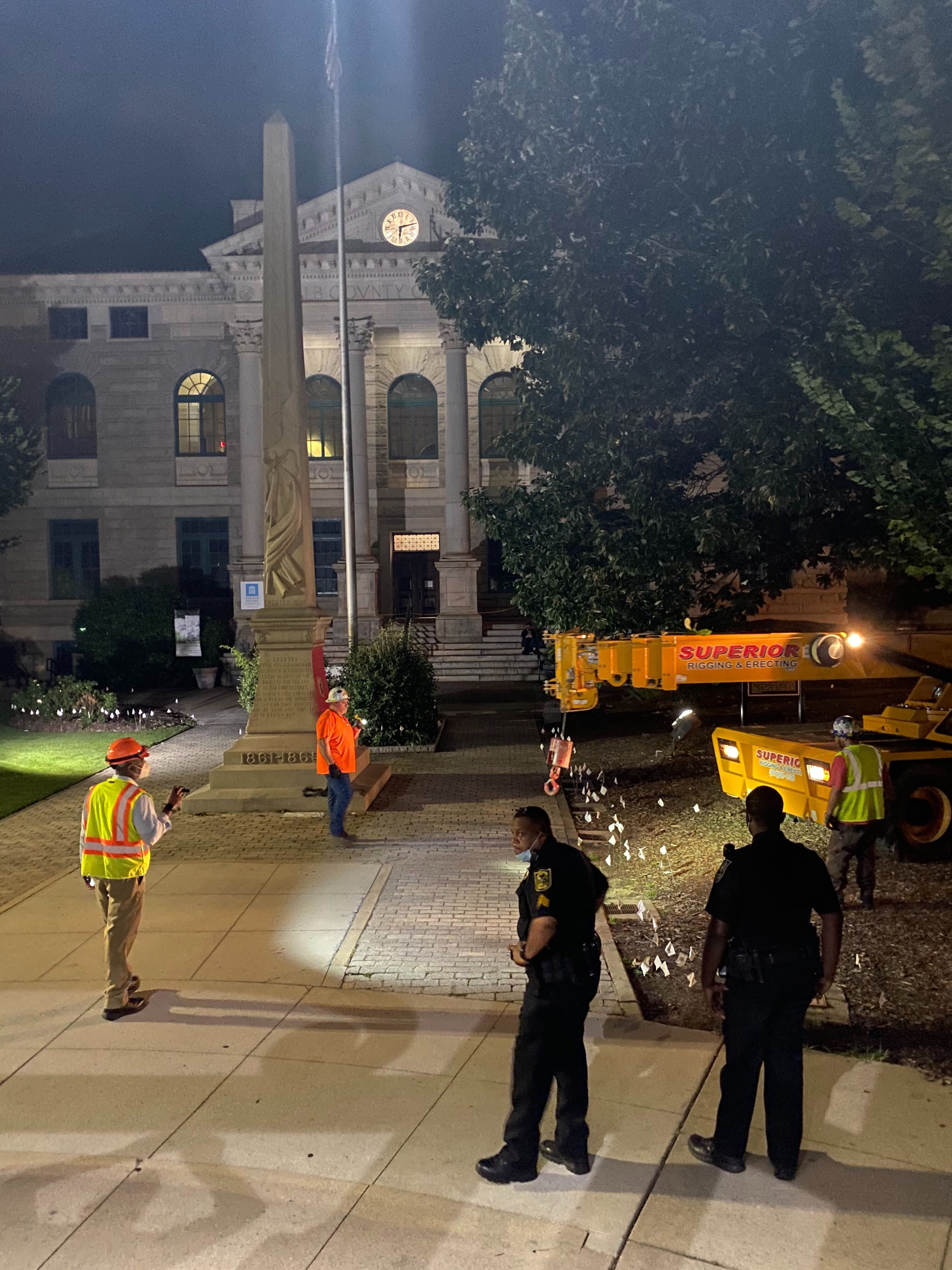 A 30-foot obelisk Confederate moment, which has stood for 112 years, was taken down in the downtown Decatur square late Thursday night. The monument was erected in 1908 by the United Daughters of the Confederacy. Photos by Amanda Coyne / AJC