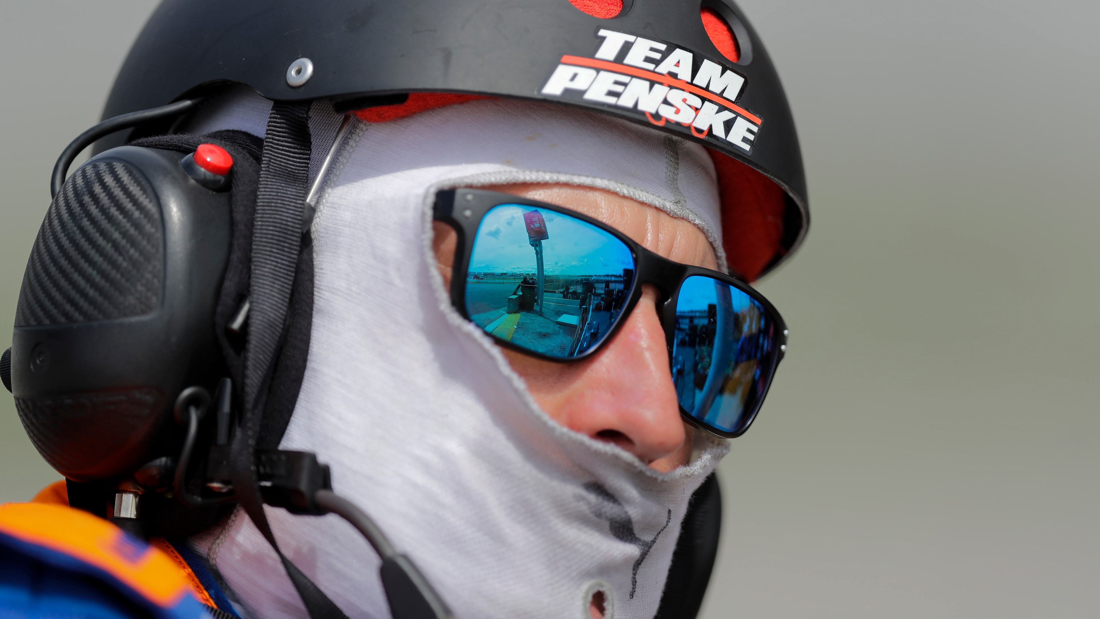 A pit crew member for Brad Keselowski - last year's winner in Hampton, Ga. - watches cars from pit road Sunday, June 7, 2020, at Atlanta Motor Speedway.