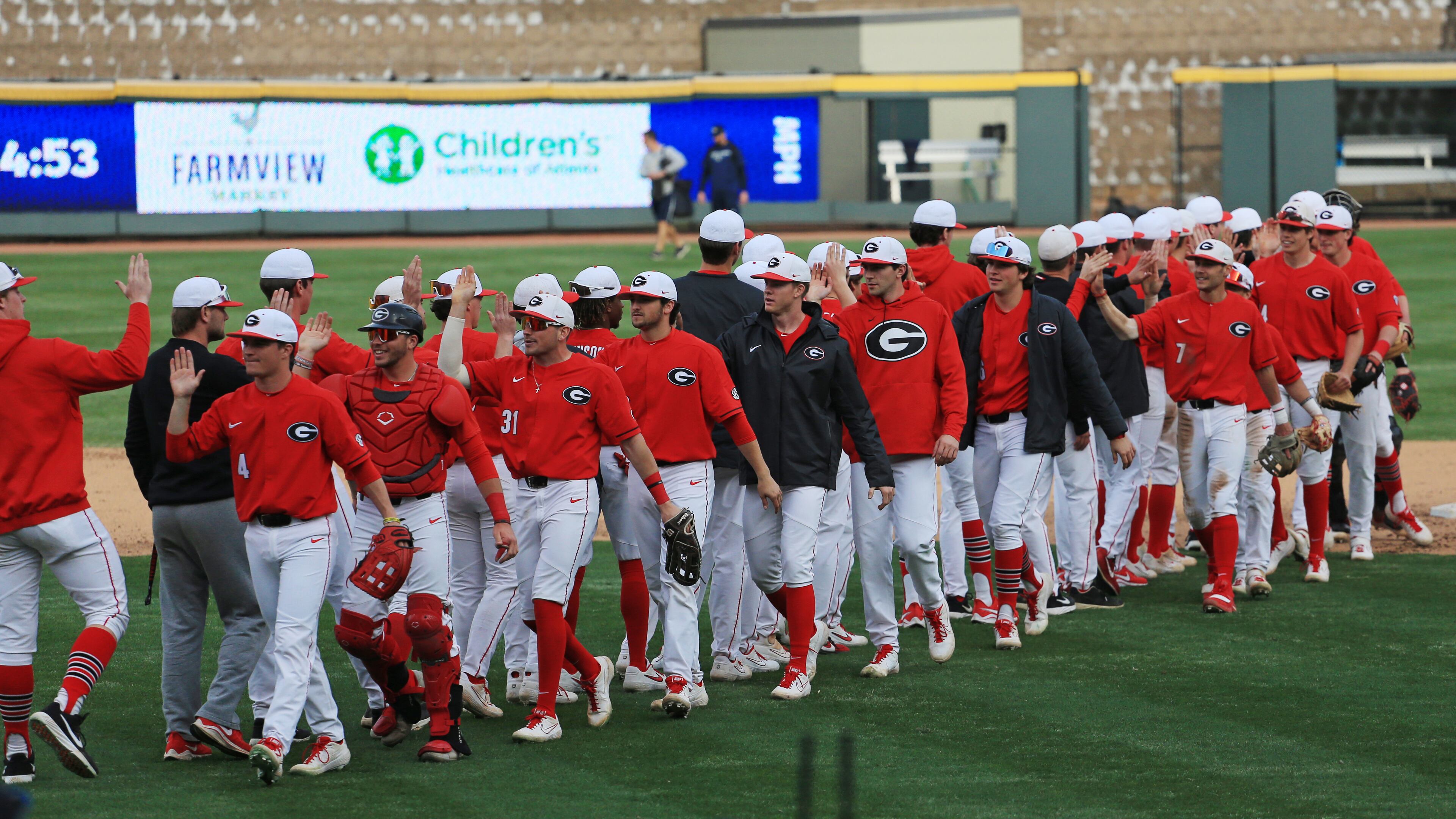 Georgia players celebrate the sweep of Georgia Tech Sunday, March 1, 2020, at Coolray Field in Lawrenceville.