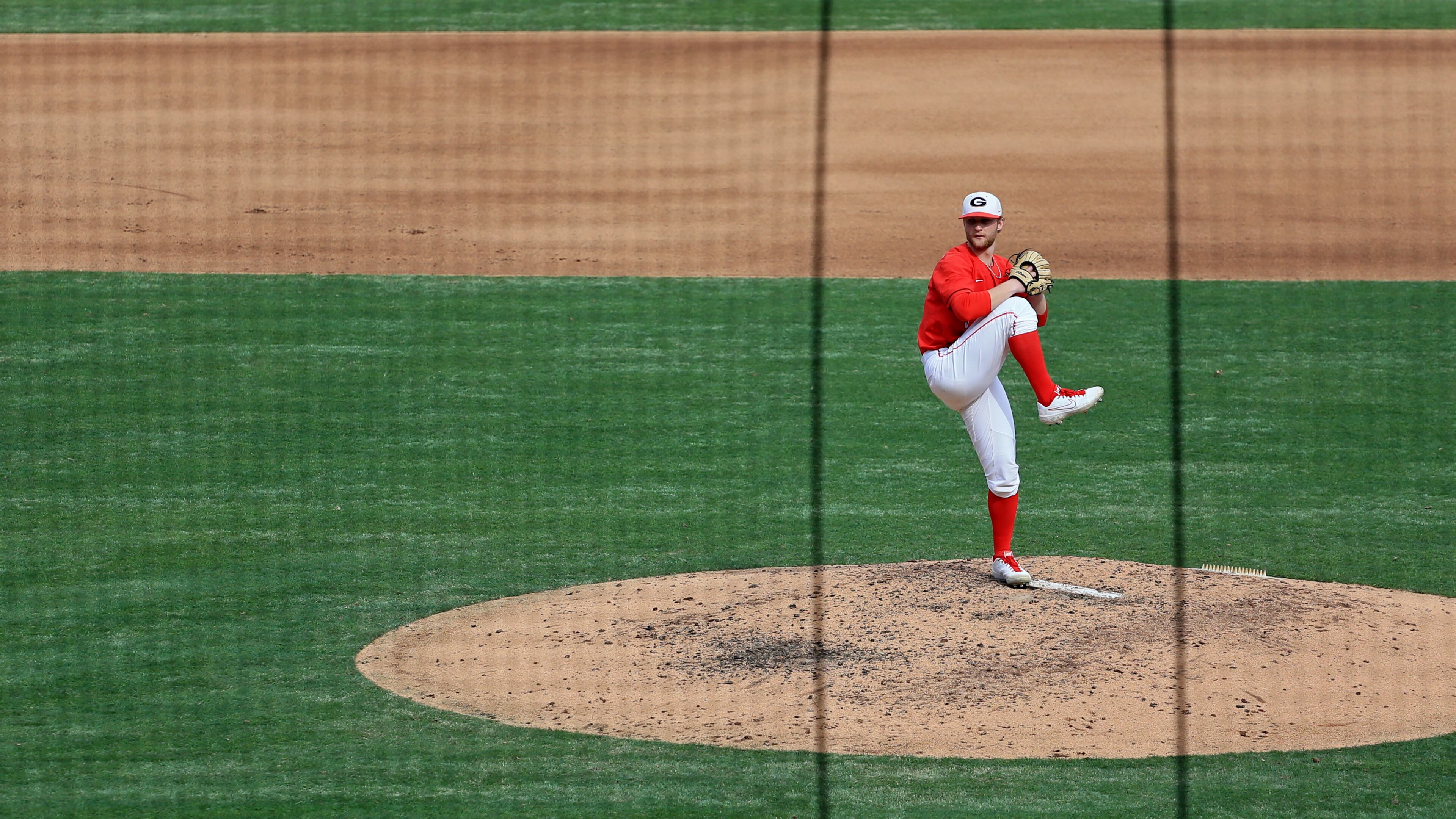 Georgia's C.J. Smith delivers a pitch against Georgia Tech Sunday, March 1, 2020, at Coolray Field in Lawrenceville. The Bulldogs won 9-3.