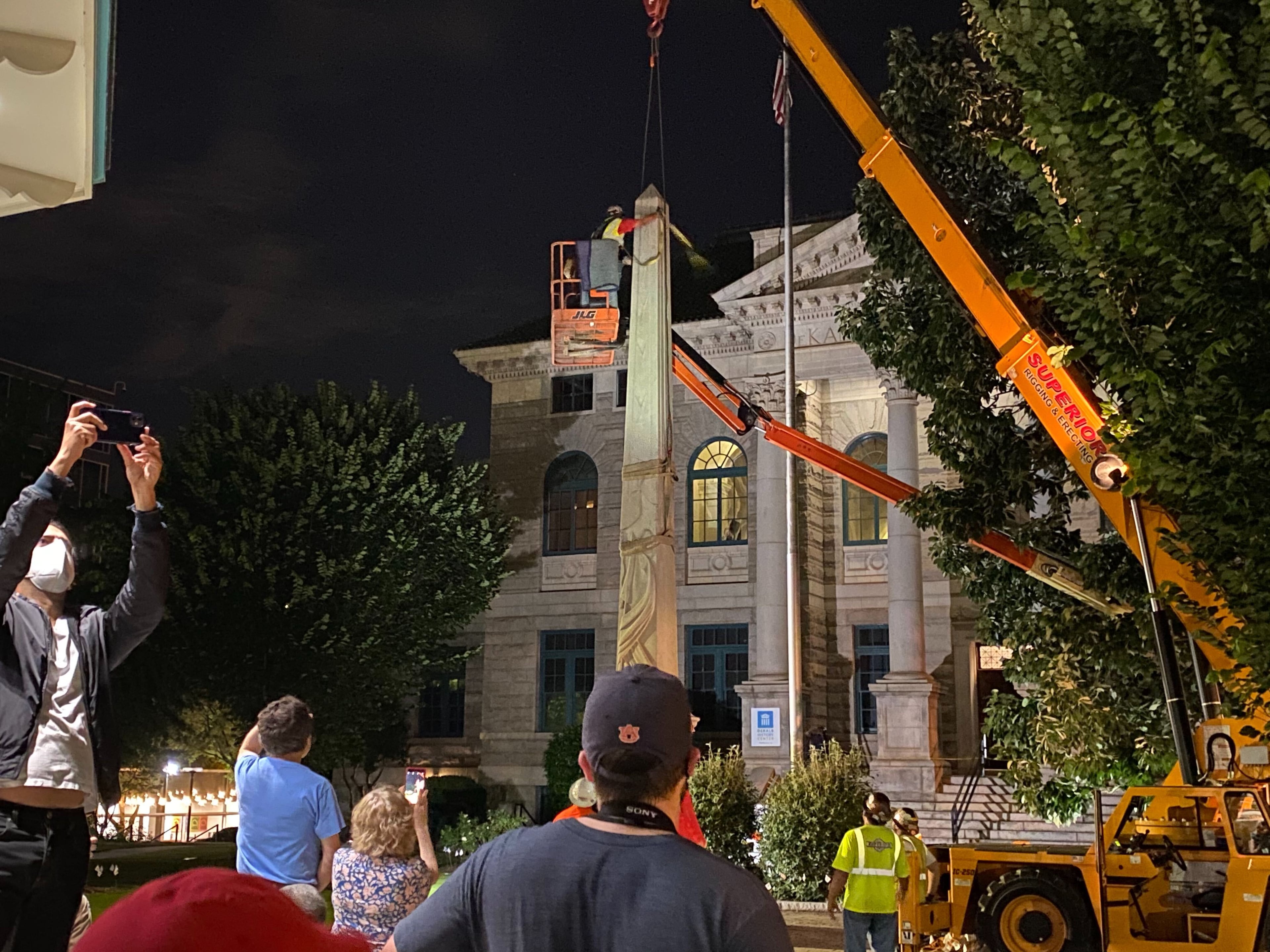 A 30-foot obelisk Confederate moment, which has stood for 112 years, was taken down in the downtown Decatur square late Thursday night. The monument was erected in 1908 by the United Daughters of the Confederacy. Photos by Amanda Coyne / AJC