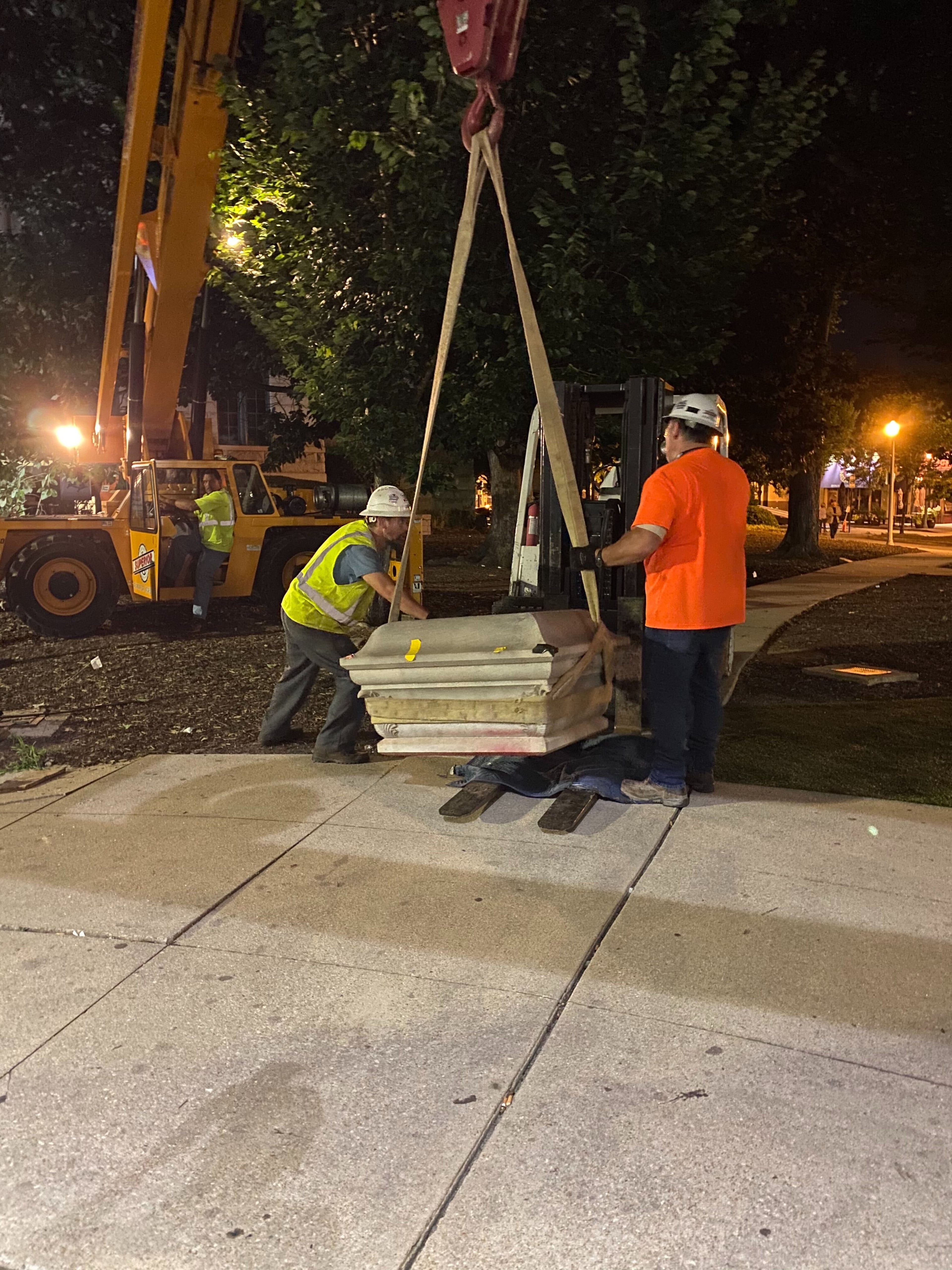 A 30-foot obelisk Confederate moment, which has stood for 112 years, was taken down in the downtown Decatur square late Thursday night. The monument was erected in 1908 by the United Daughters of the Confederacy. Photos by Amanda Coyne / AJC