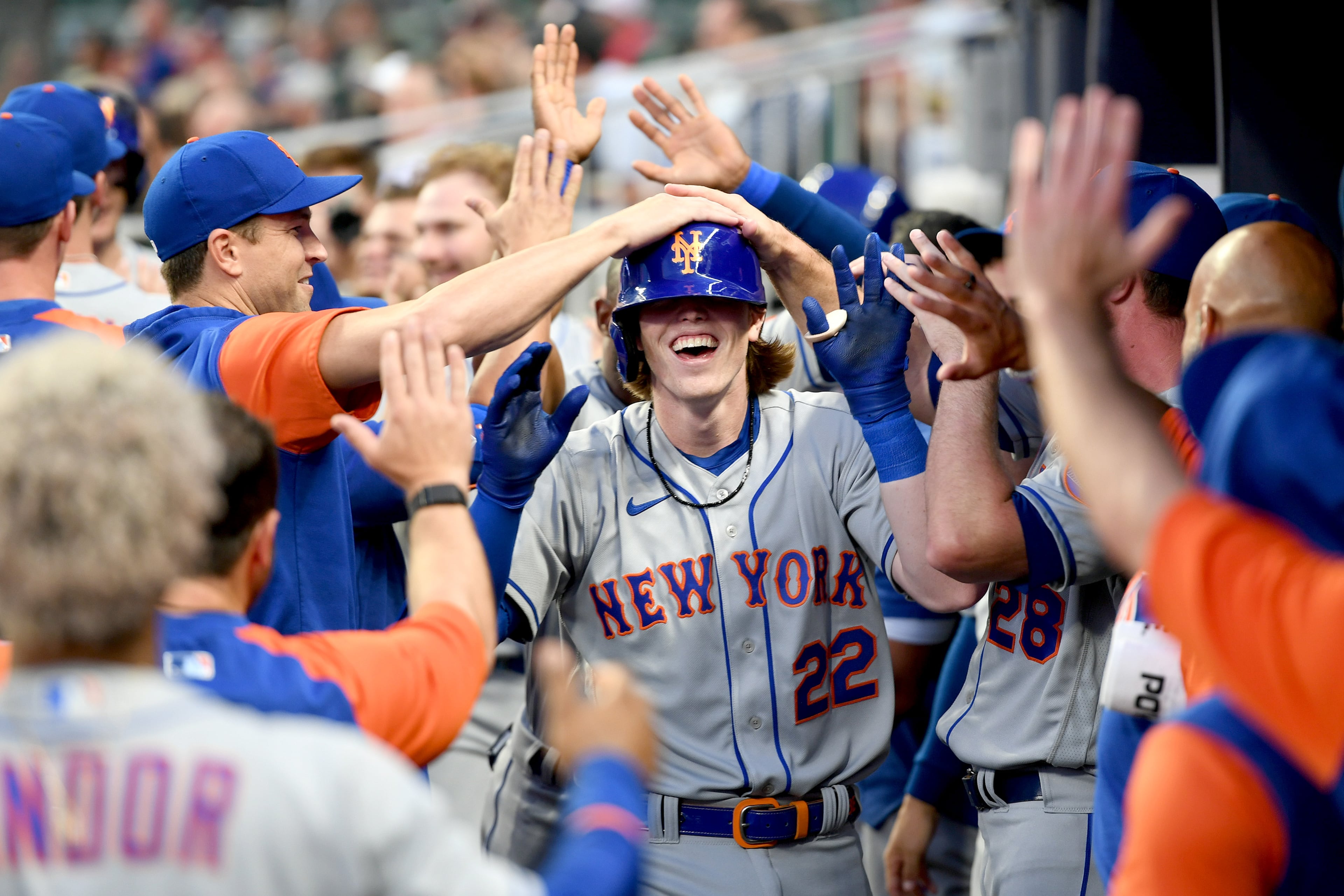 The New York Mets' Brett Baty (22) celebrates with teammates after hitting his first home run during his first MLB at bat, against the Atlanta Braves in the second inning at Truist Park on Wednesday, Aug. 17, 2022, in Atlanta. (Adam Hagy/Getty Images/TNS)