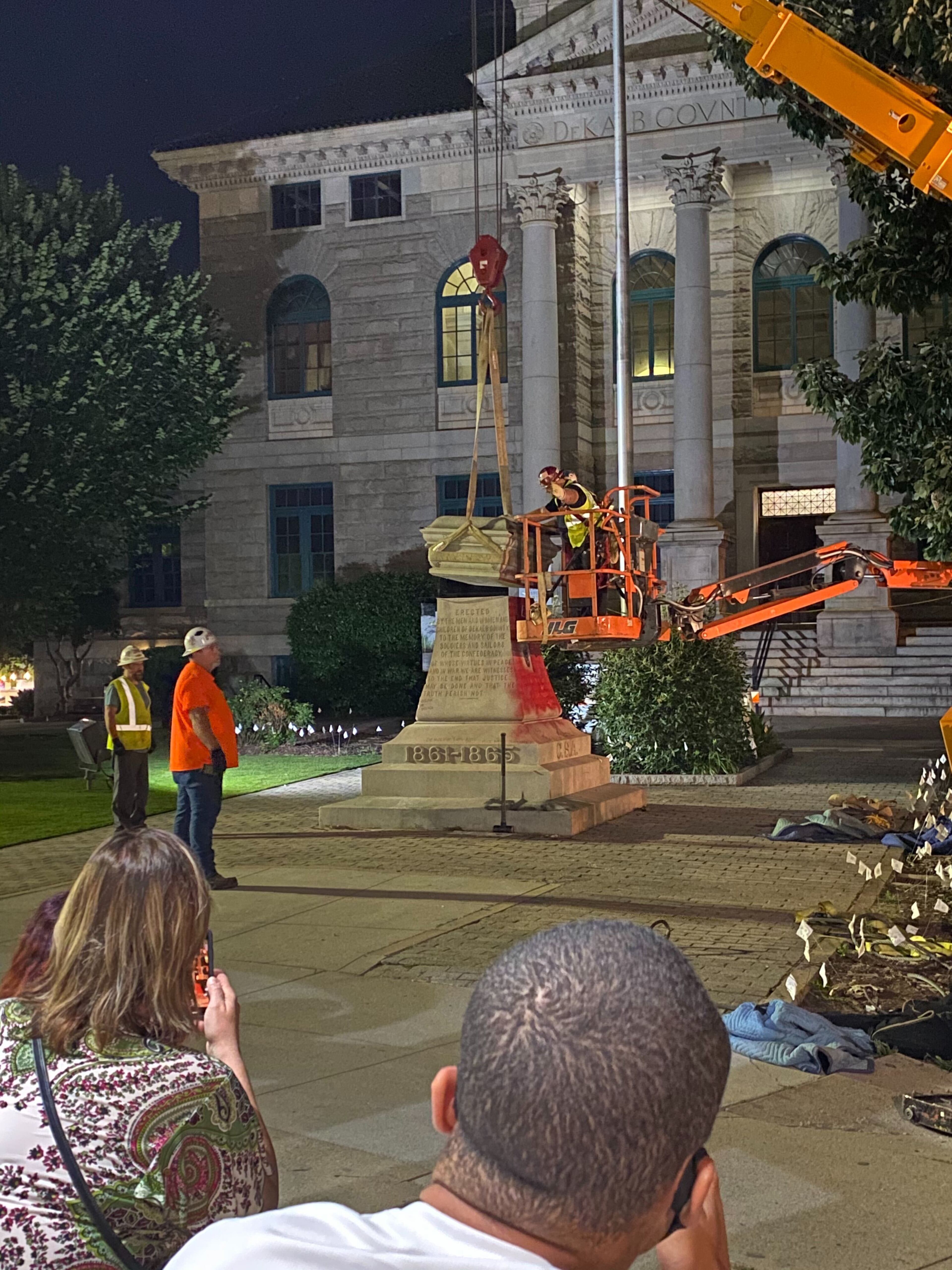 A 30-foot obelisk Confederate moment, which has stood for 112 years, was taken down in the downtown Decatur square late Thursday night. The monument was erected in 1908 by the United Daughters of the Confederacy. Photos by Amanda Coyne / AJC