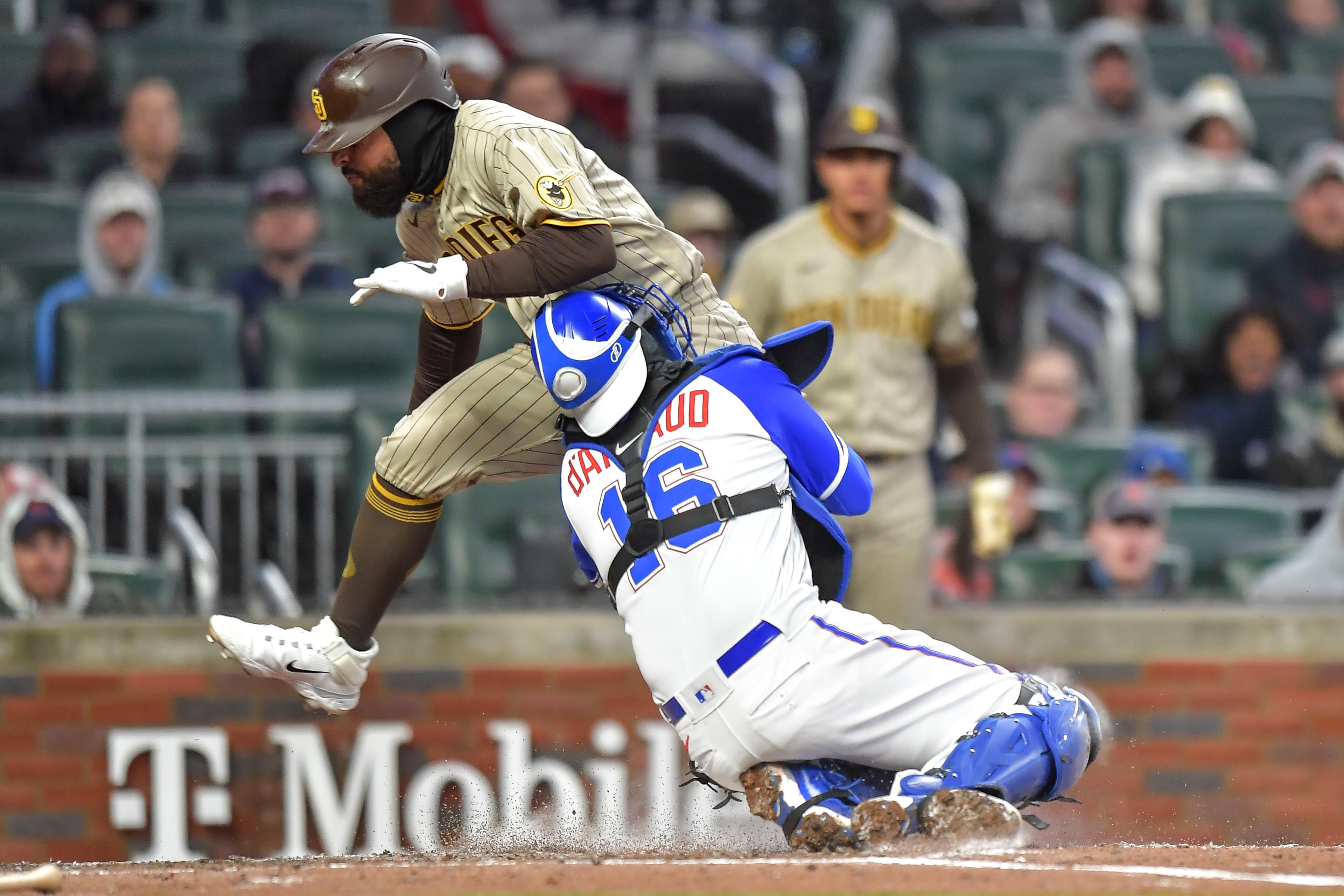 Atlanta Braves catcher Travis d'Arnaud (16) tags San Diego Padres second baseman Rougned Odor (24) out at home in the fourth inning Saturday, April 8, 2023 at Truist Park in Atlanta. (Daniel Varnado / For the AJC)