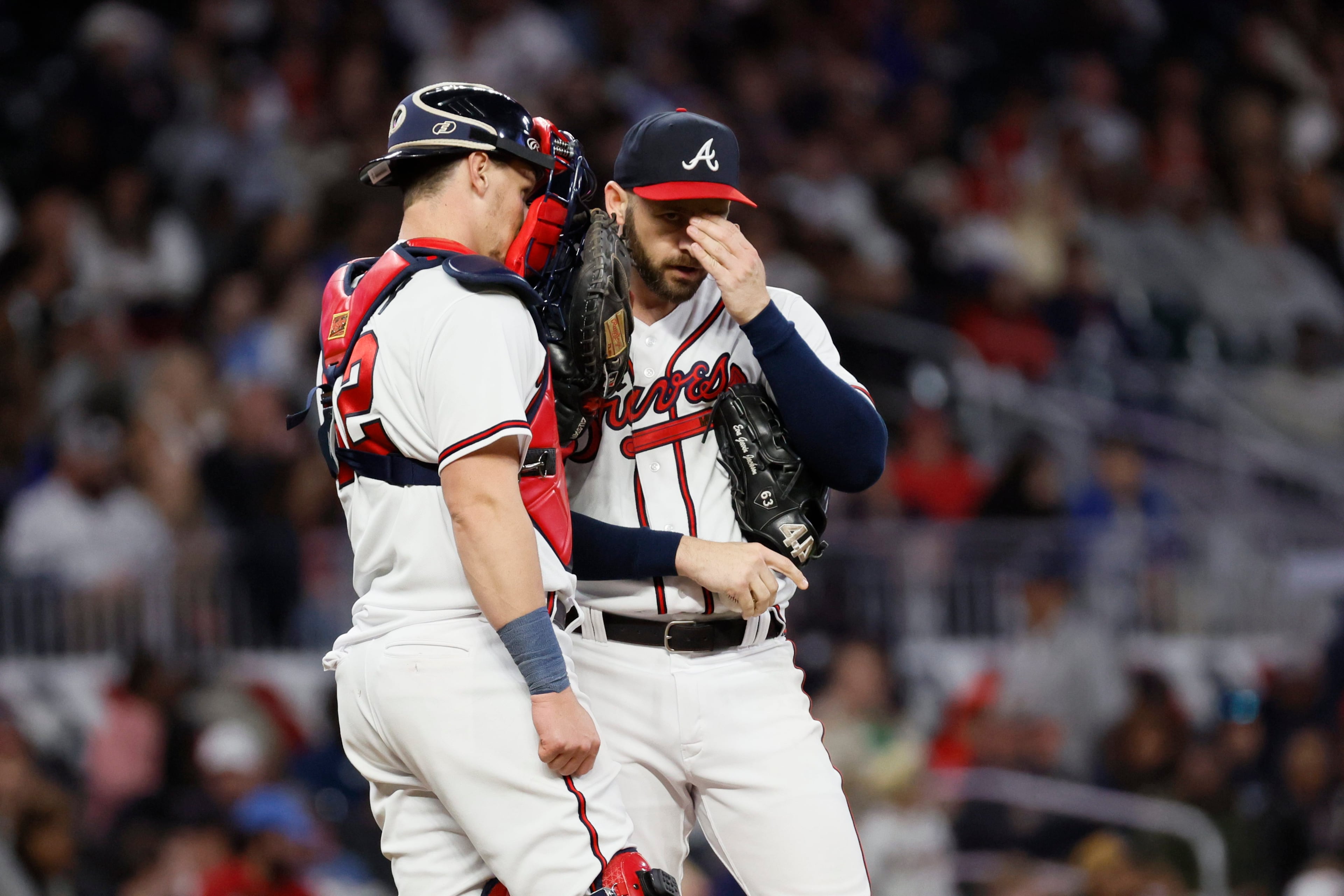 Atlanta Braves relief pitcher Lucas Luetge (63) speaks with catcher Sean Murphy (12) during the fifth inning on Sunday, April 9, 2023, at Truist Park
Miguel Martinez /miguel.martinezjimenez@ajc.com