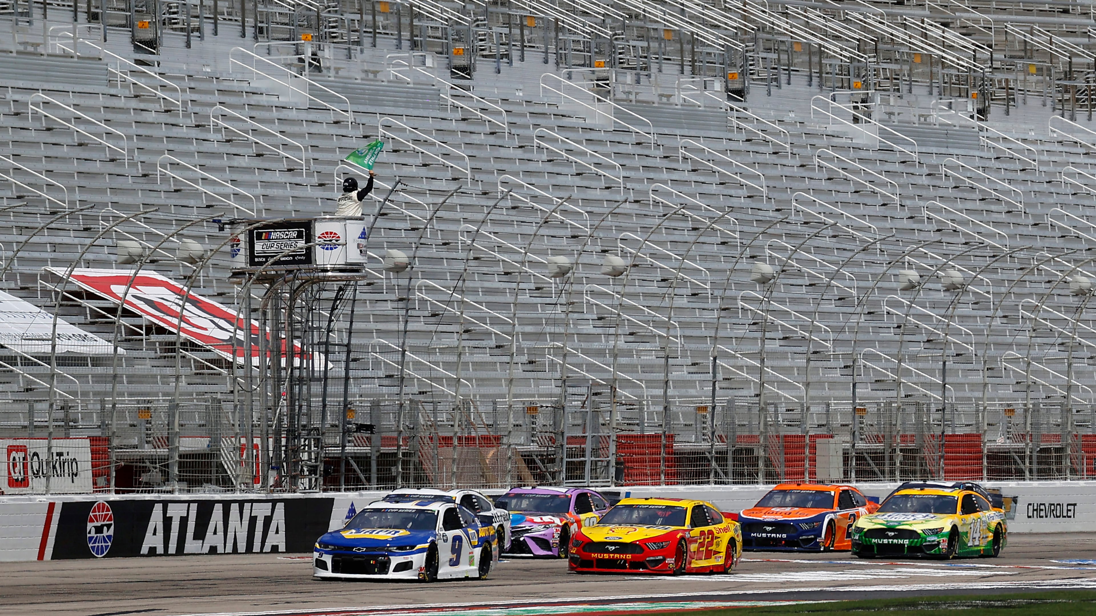 Chase Elliott (9) leads the field to the green flag to start the Folds of Honor QuikTrip 500 Sunday, June 7, 2020, at Atlanta Motor Speedway in Hampton, Ga. The NASCAR race, run without spectators, had been postponed by the coronavirus pandemic.