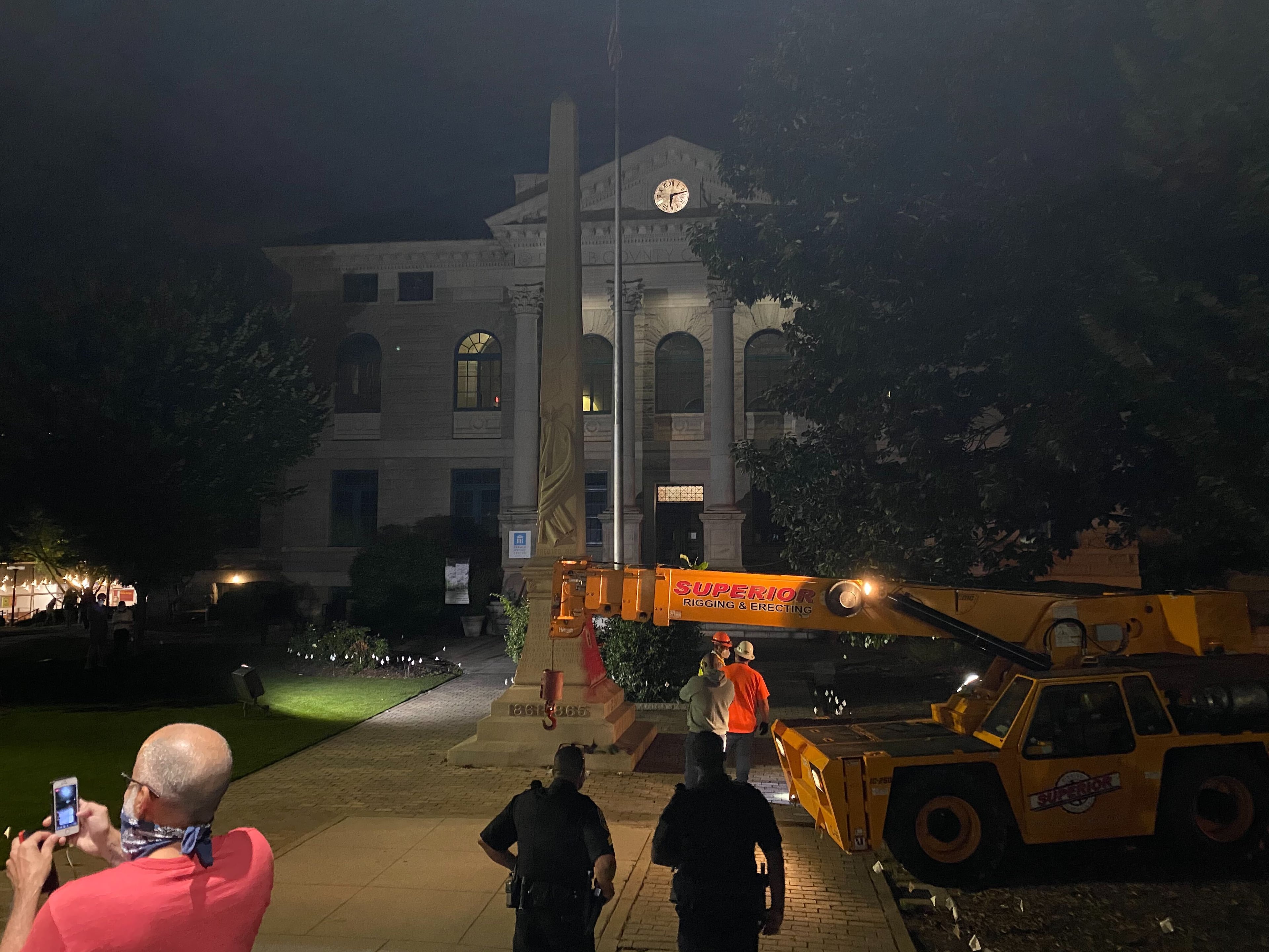 A 30-foot obelisk Confederate moment, which has stood for 112 years, was taken down in the downtown Decatur square late Thursday night. The monument was erected in 1908 by the United Daughters of the Confederacy. Photos by Amanda Coyne / AJC