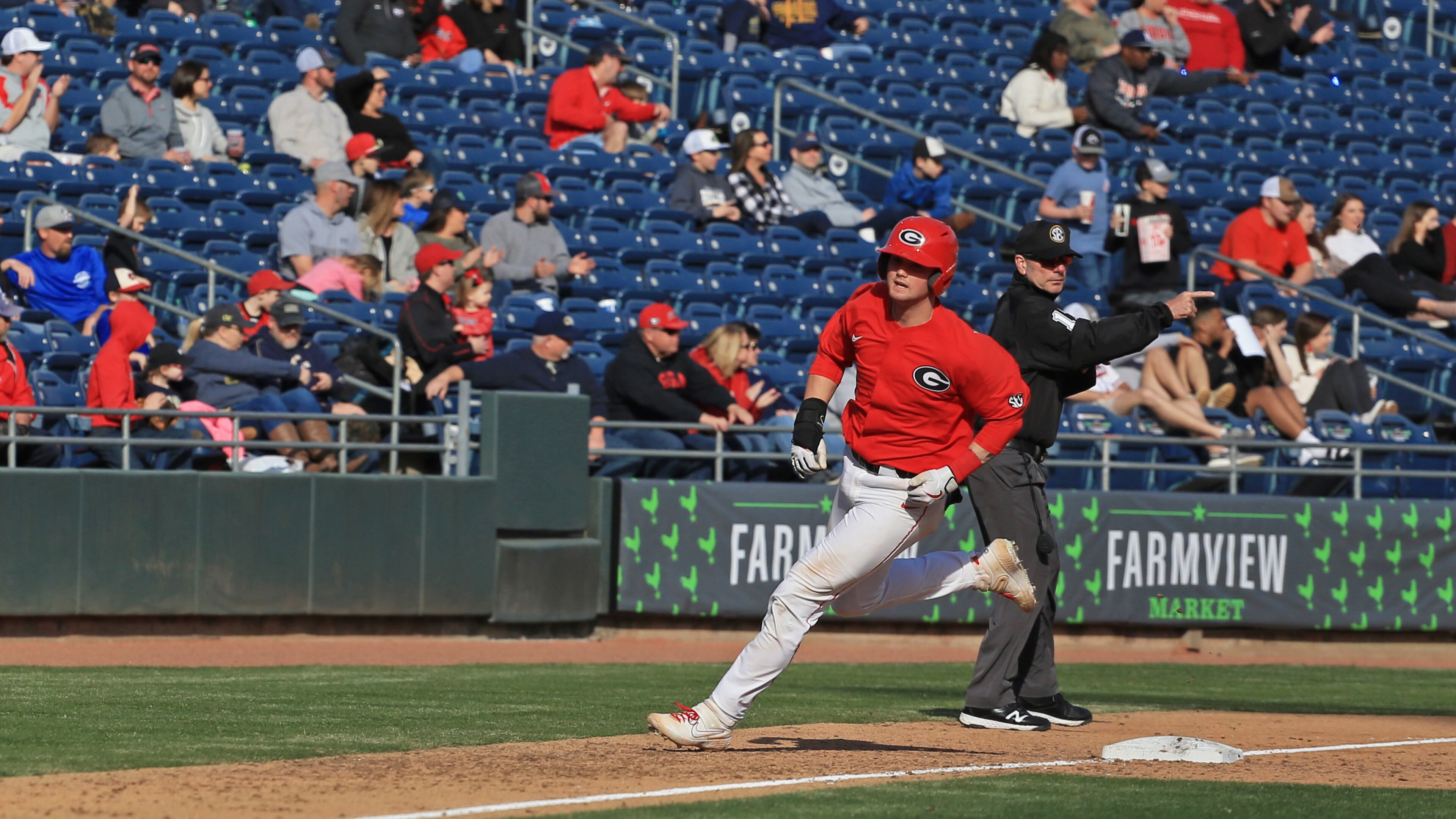 Bulldogs catcher Shane Marshall runs home to score against Georgia Tech Sunday, March 1, 2020, at Coolray Field in Lawrenceville. The Bulldogs won 9-3.