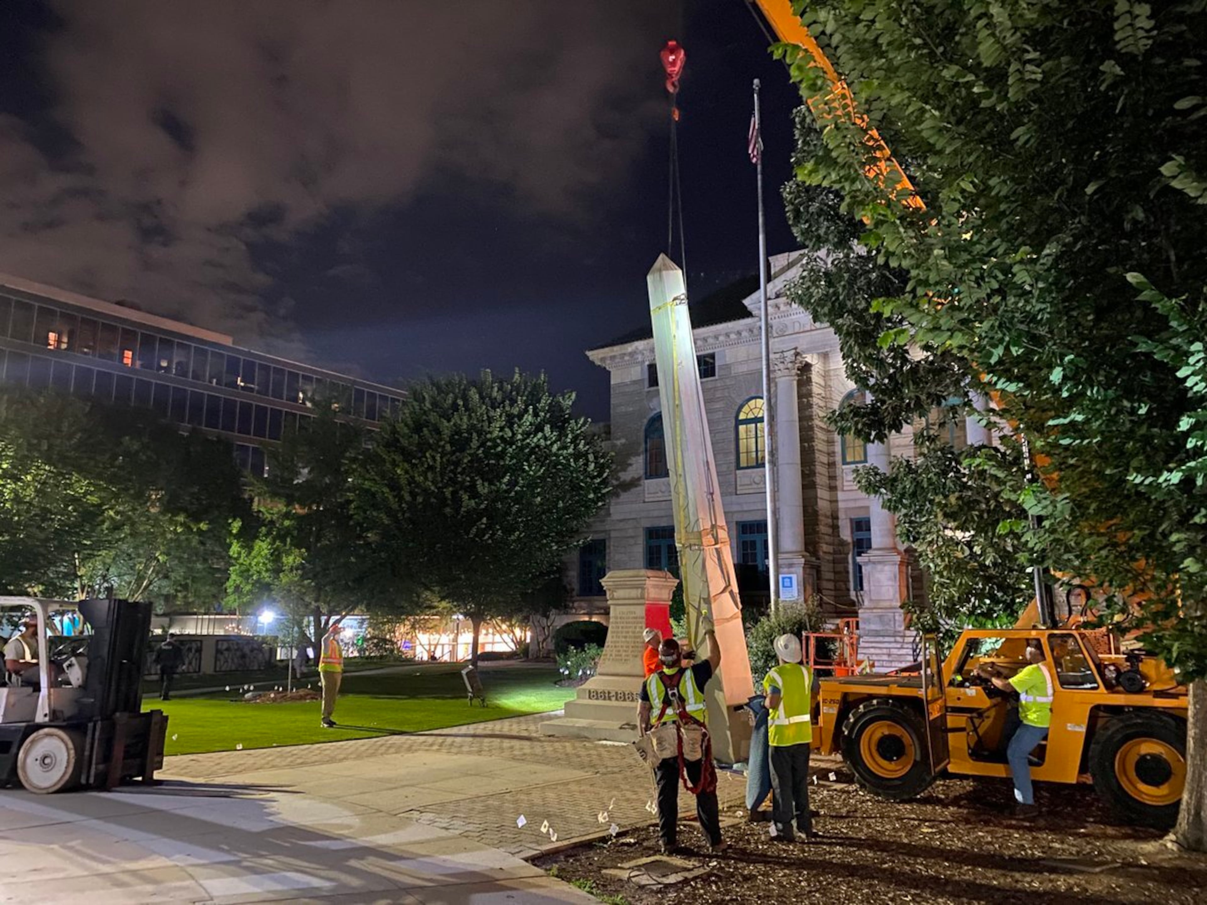 A 30-foot obelisk Confederate moment, which has stood for 112 years, was taken down in the downtown Decatur square late Thursday night. The monument was erected in 1908 by the United Daughters of the Confederacy. Photos by Amanda Coyne / AJC