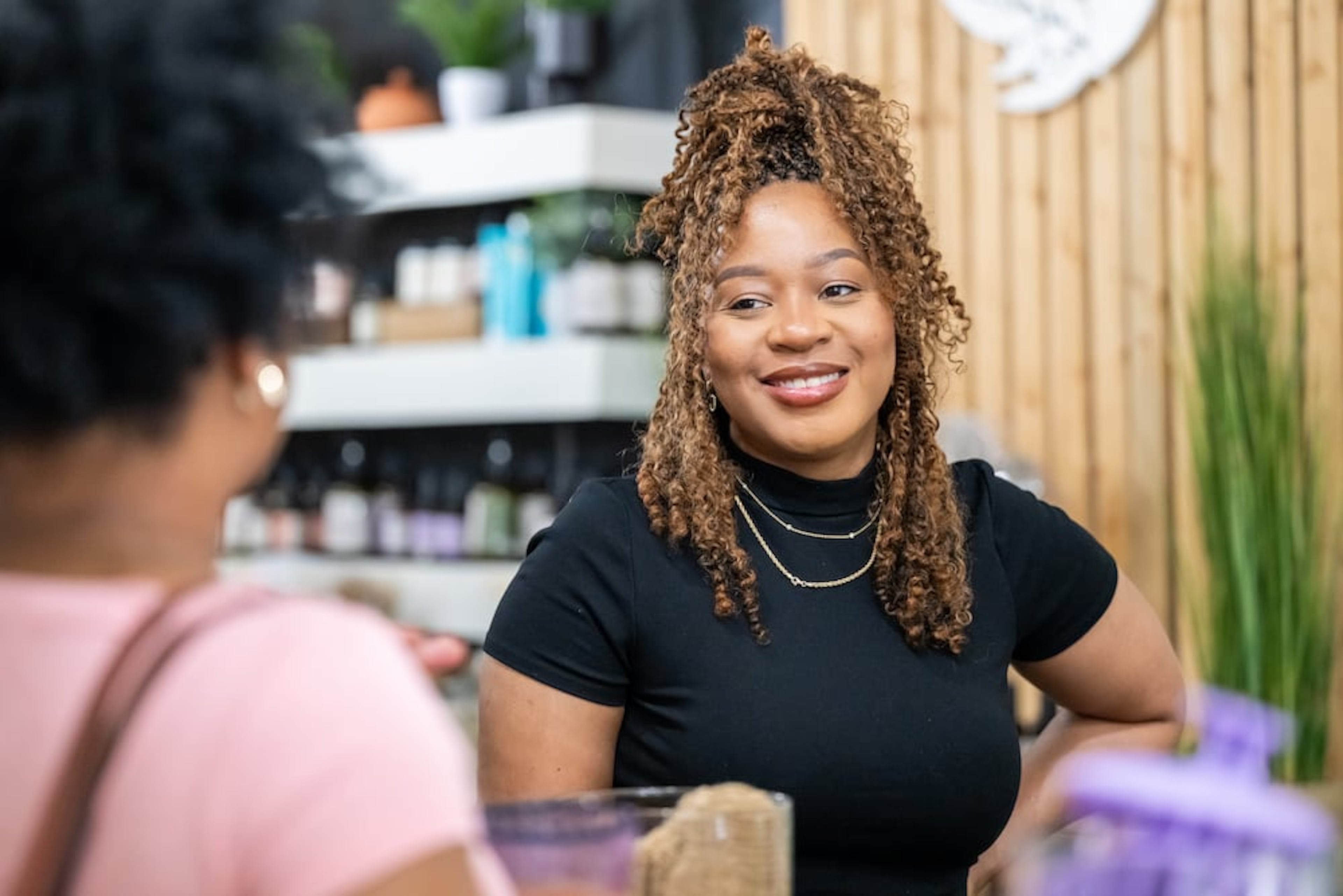 Ty Jenkins helps a customer at Olive Branch in downtown Decatur, April 29, 2025.