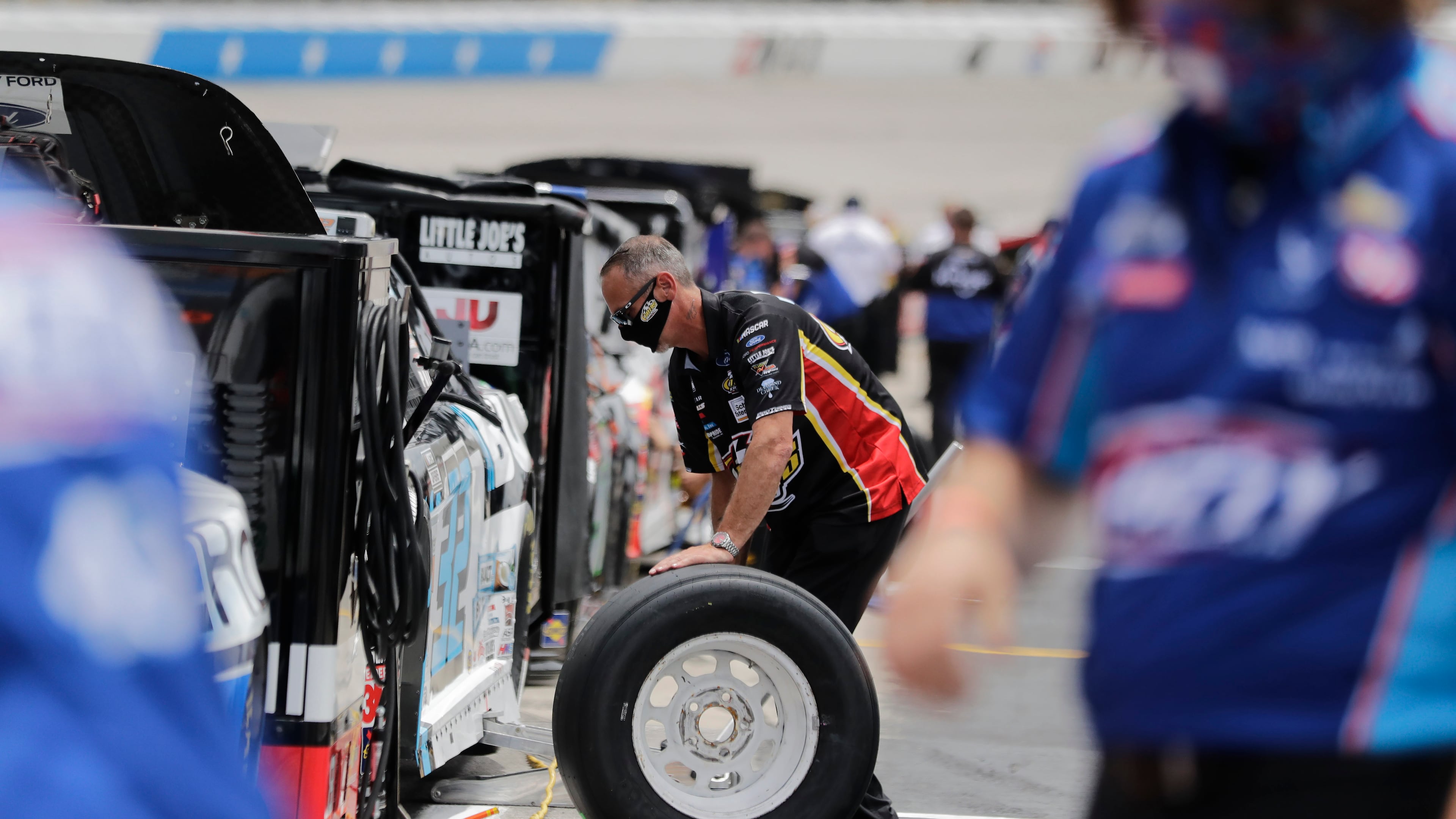 A crew member of Corey LaJoie (32) prepares for the Folds of Honor QuikTrip 500 Sunday, June 7, 2020, at Atlanta Motor Speedway in Hampton, Ga.