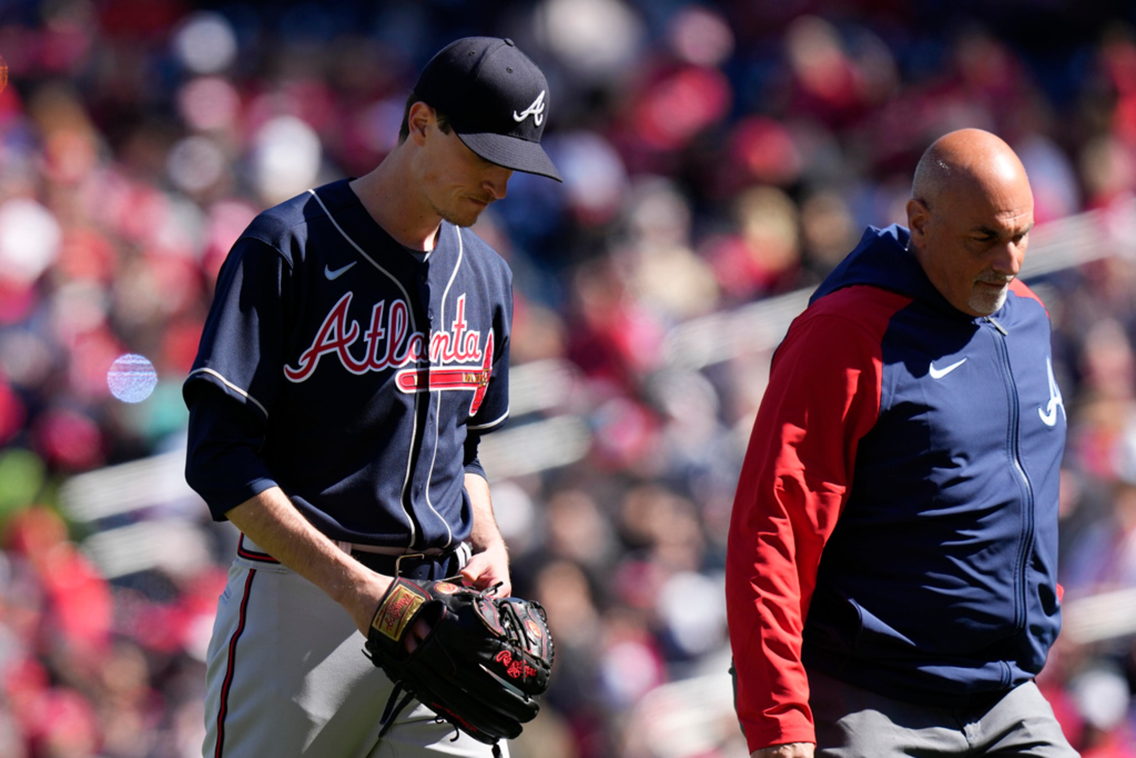 Atlanta Braves starting pitcher Max Fried, left, walks off the field during the fourth inning of an opening day baseball game against the Washington Nationals at Nationals Park, Thursday, March 30, 2023, in Washington. (AP Photo/Alex Brandon)