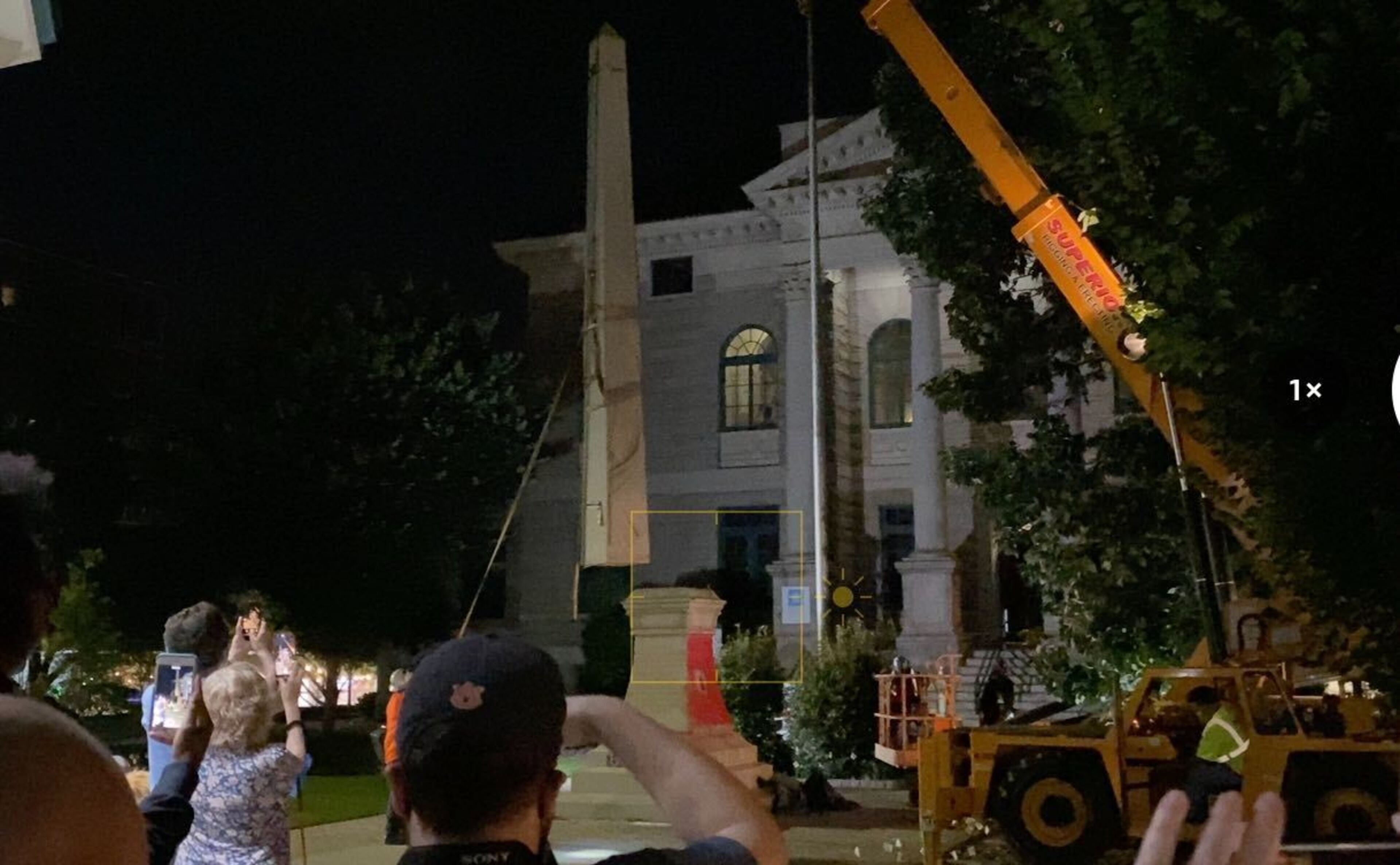A 30-foot obelisk Confederate moment, which has stood for 112 years, was taken down in the downtown Decatur square late Thursday night. The monument was erected in 1908 by the United Daughters of the Confederacy. Photos by Amanda Coyne / AJC